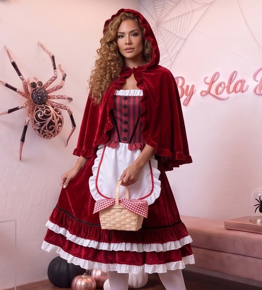 Disfraz de Caperucita Roja estilo gótico y fantasía para mujer, compuesto por vestido de terciopelo rojo vino con corpiño a rayas, delantal blanco con volantes, falda acampanada con ribete blanco y capa corta a juego con capucha amplia con fruncidos.