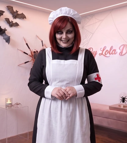 Disfraz vintage de enfermera de época victoriana o monja médica para mujer, compuesto por vestido largo negro de cuello alto y manga larga con puños blancos, delantal blanco con tirantes cruzados a la espalda, brazalete blanco con cruz roja y cofia blanca fruncida a juego