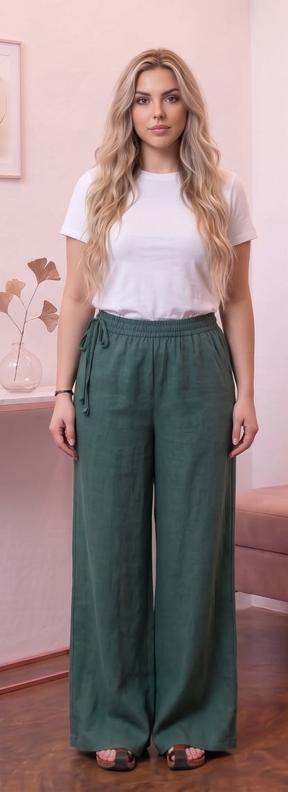 Pantalón ancho para mujer en mezcla de algodón y lino, diseño recto y fluido de tiro alto con cintura elástica fruncida, bolsillos funcionales y detalle de cordón ajustable anudado en el lateral de la cintura, disponible en una variedad de colores lisos.