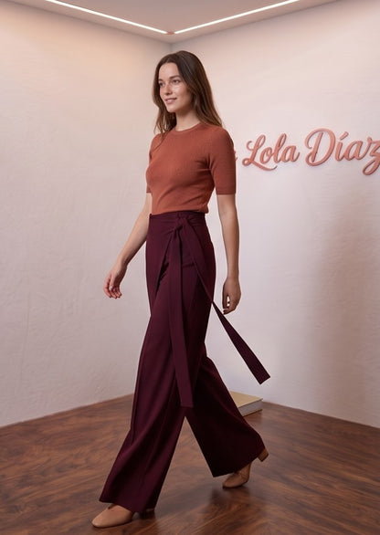 pantalones palazzo muy anchos para mujer, con un diseño wrap cruzado que crea un efecto falda superpuesto y una tira larga lateral que se anuda en la cintura. Disponibles en una variedad de siete colores vibrantes