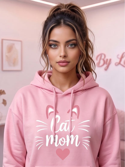 Sudadera hoodie con capucha de mujer corte holgado con estampado Cat Mom, orejitas de gato y corazón central. Diseño casual con bolsillo canguro delantero y mangas largas abullonadas, disponible en 8 colores: rosa, blanco, negro, gris jaspeado, marrón café, verde oscuro, albaricoque y morado