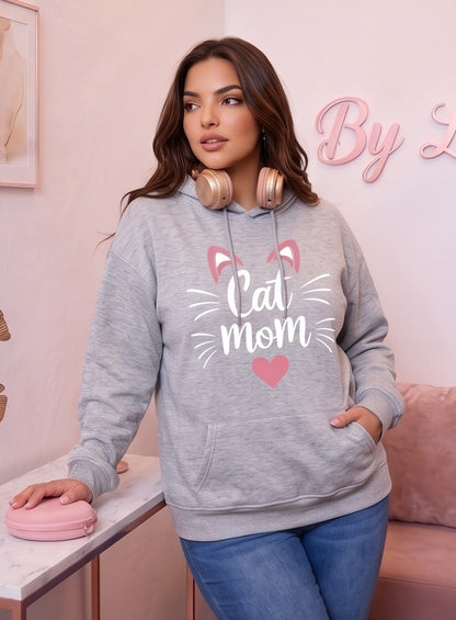 Sudadera hoodie con capucha de mujer corte holgado con estampado Cat Mom, orejitas de gato y corazón central. Diseño casual con bolsillo canguro delantero y mangas largas abullonadas, disponible en 8 colores: rosa, blanco, negro, gris jaspeado, marrón café, verde oscuro, albaricoque y morado