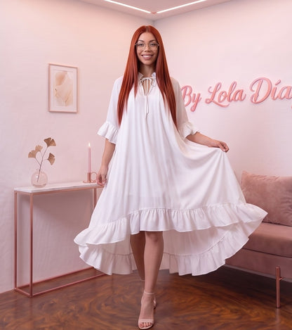 Detalle del dobladillo, costuras y acabado de Vestido midi holgado para mujer en colores liso negro, blanco, fucsia, verde esmeralda y rojo anaranjado, con escote redondo fruncido ajustable con lazo, mangas al codo acampanadas y falda fluida con doble volante en el bajo